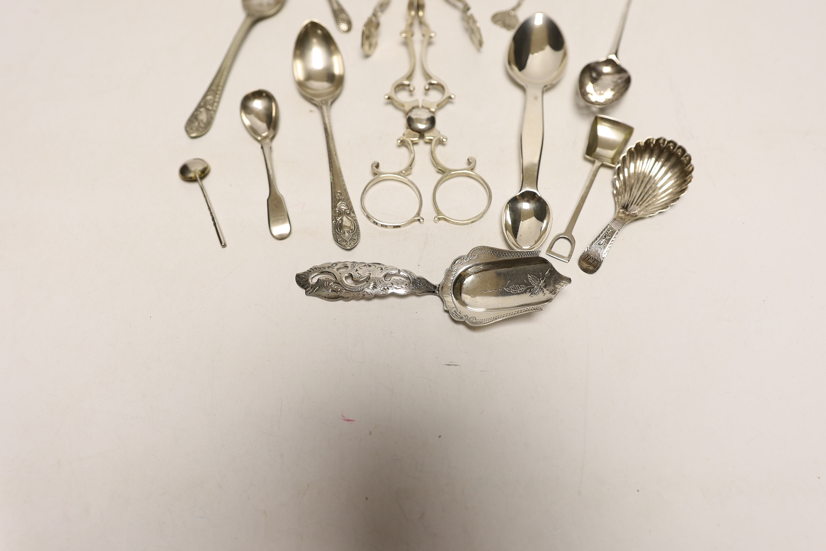 A small quantity of assorted silver flatware etc. including spoons, caddy spoon, condiment spoons, 18th century mote spoon and two pairs of sugar nips.